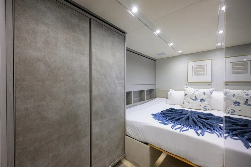 Halcyon Yacht Photos Pics Luxurious bedroom interior on 2018 Sanlorenzo SD112 yacht with modern decor and cozy bedding.