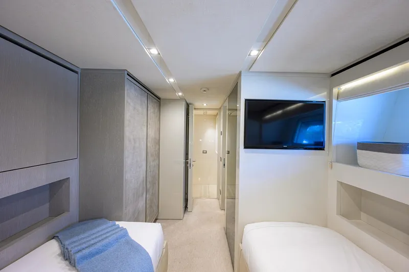 Halcyon Yacht Photos Pics Luxurious interior of 2018 Sanlorenzo SD112 yacht cabin with modern decor and TV.