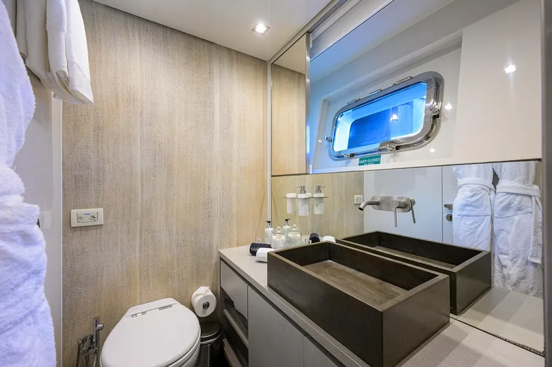 Halcyon Yacht Photos Pics Luxurious bathroom on 2018 Sanlorenzo SD112 yacht with modern fixtures and ocean view.