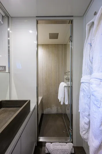 Halcyon Yacht Photos Pics Luxurious bathroom on 2018 Sanlorenzo SD112 yacht with modern shower and plush robe.