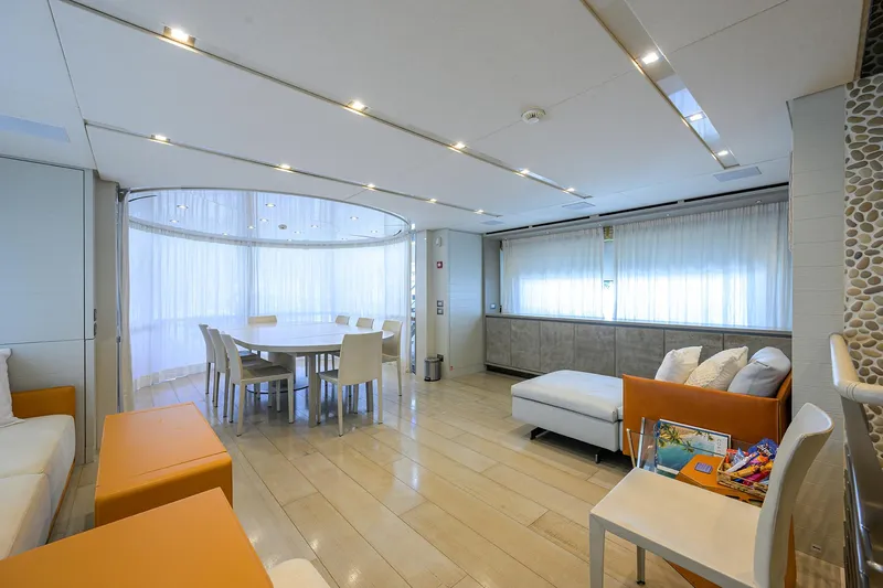 Halcyon Yacht Photos Pics Luxurious interior of 2018 Sanlorenzo SD112 yacht with modern dining area and seating.