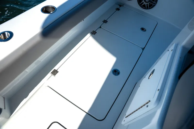  Yacht Photos Pics 2024 Freeman 28 boat deck with storage compartments and cup holders.