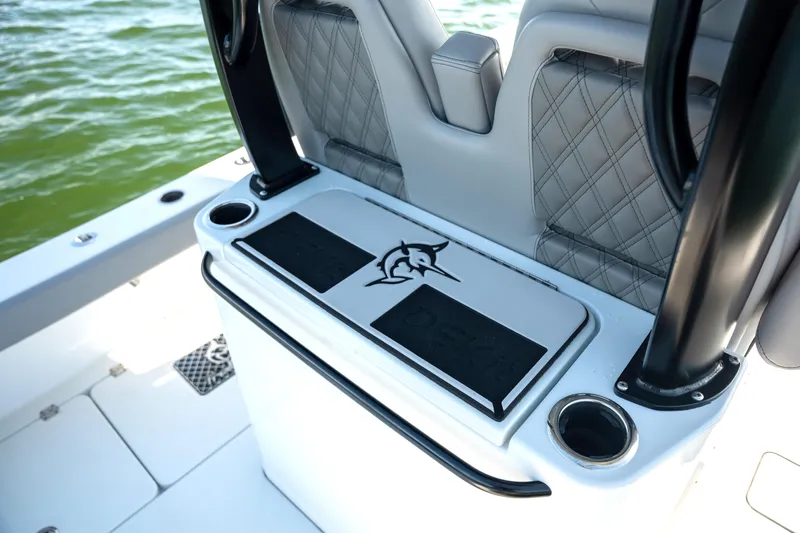  Yacht Photos Pics 2024 Freeman 28 boat interior with cushioned seating and cup holders on deck.