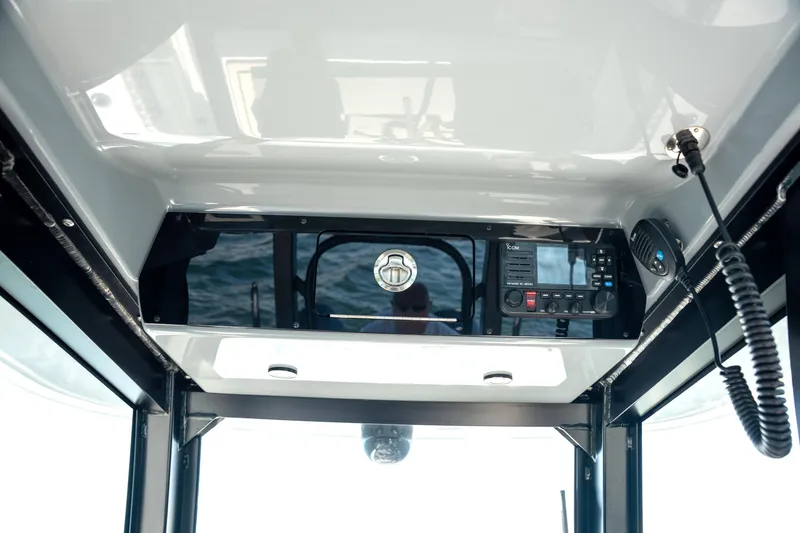  Yacht Photos Pics Interior view of 2024 Freeman 28 boat cockpit with communication equipment.