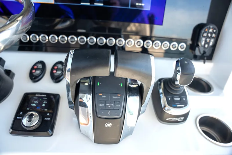  Yacht Photos Pics Control panel of 2024 Freeman 28 boat with advanced navigation and throttle systems.