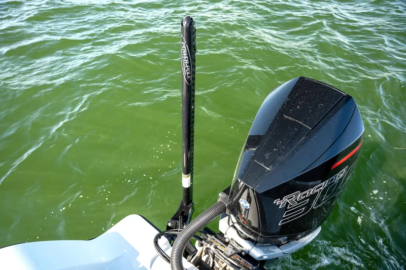  Yacht Photos Pics Freeman 28 boat with powerful outboard motor on green water, 2024 model.