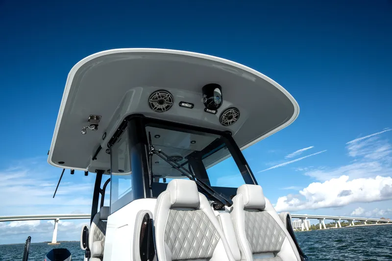  Yacht Photos Pics 2024 Freeman 28 boat with sleek design, modern seating, and clear blue sky backdrop.