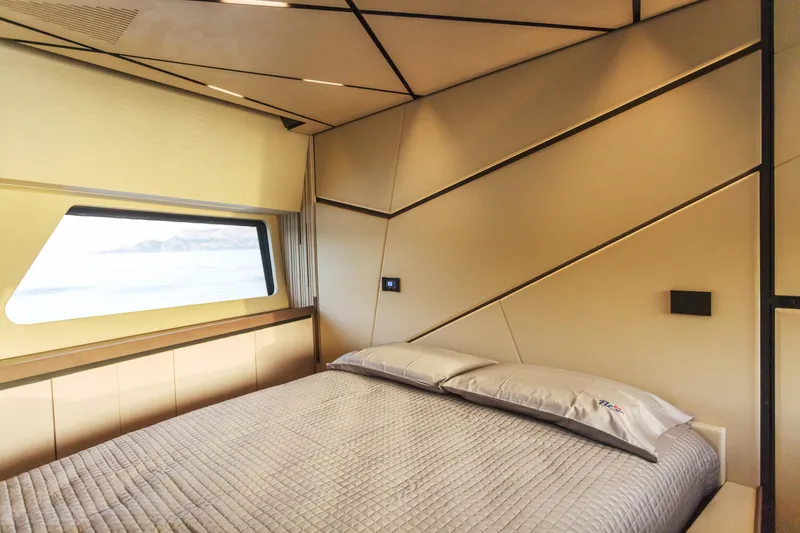 Maori 64 Yacht Photos Pics Luxurious bedroom interior of 2025 Maori M64 yacht with modern design and ocean view.