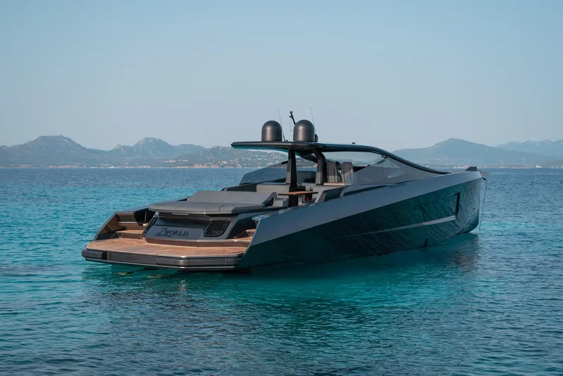 Maori 64 Yacht Photos Pics Luxury Maori M64 yacht, 2025 model, on clear blue water with scenic mountain backdrop.