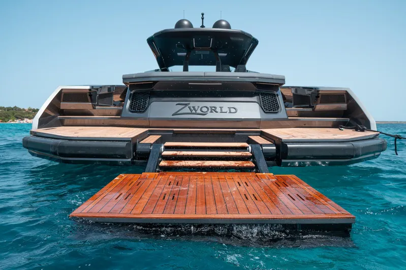 Maori 64 Yacht Photos Pics Luxury Maori M64 yacht with wooden deck, 2025 model, on clear blue water.