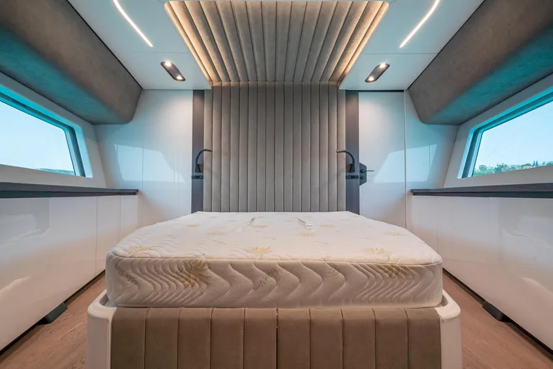 Maori 64 Yacht Photos Pics Luxurious interior of 2025 Maori M64 yacht with modern bed and ambient lighting.
