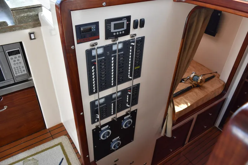 Hardtimes Yacht Photos Pics Electrical panel inside 2009 Northern Bay 38 Sportfish boat, featuring control switches and gauges.