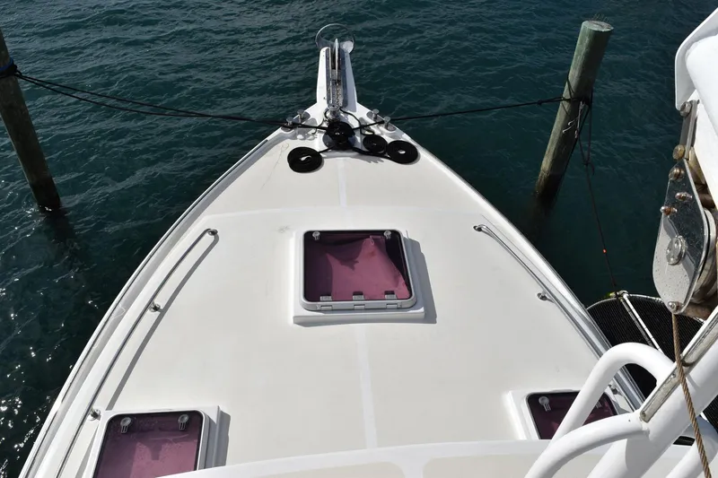 Hardtimes Yacht Photos Pics 2009 Northern Bay 38 Sportfish boat deck, docked, with hatches and railing visible.