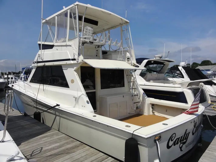  Yacht Photos Pics 1990 Viking 45 Convertible yacht docked at marina, featuring spacious deck and flybridge.