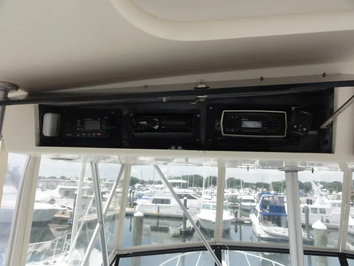  Yacht Photos Pics 1990 Viking 45 Convertible boat dashboard with navigation equipment and marina view.