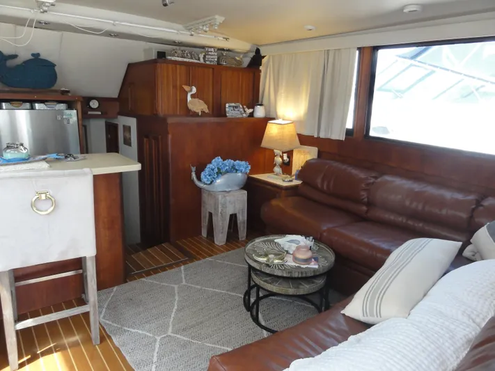  Yacht Photos Pics Luxurious interior of a 1990 Viking 45 Convertible yacht with leather seating and nautical decor.