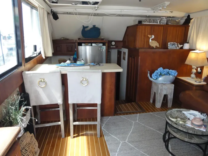  Yacht Photos Pics Interior of a 1990 Viking 45 Convertible yacht with cozy seating and decor.