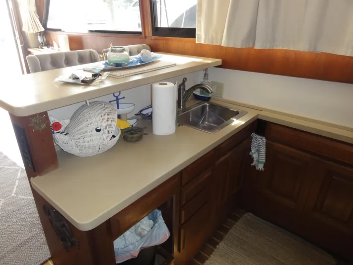  Yacht Photos Pics Interior of 1990 Viking 45 Convertible yacht kitchen with sink and countertop.