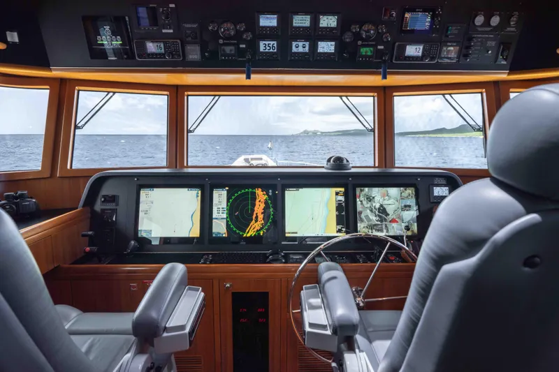 Martini Yacht Photos Pics Pilothouse of 2022 Nordhavn N63 yacht with advanced navigation systems and ocean view.