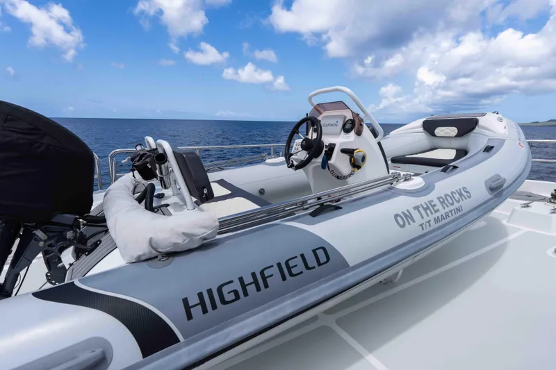 Martini Yacht Photos Pics Inflatable boat on Nordhavn N63 yacht deck, ocean view, clear sky, 2022 model.