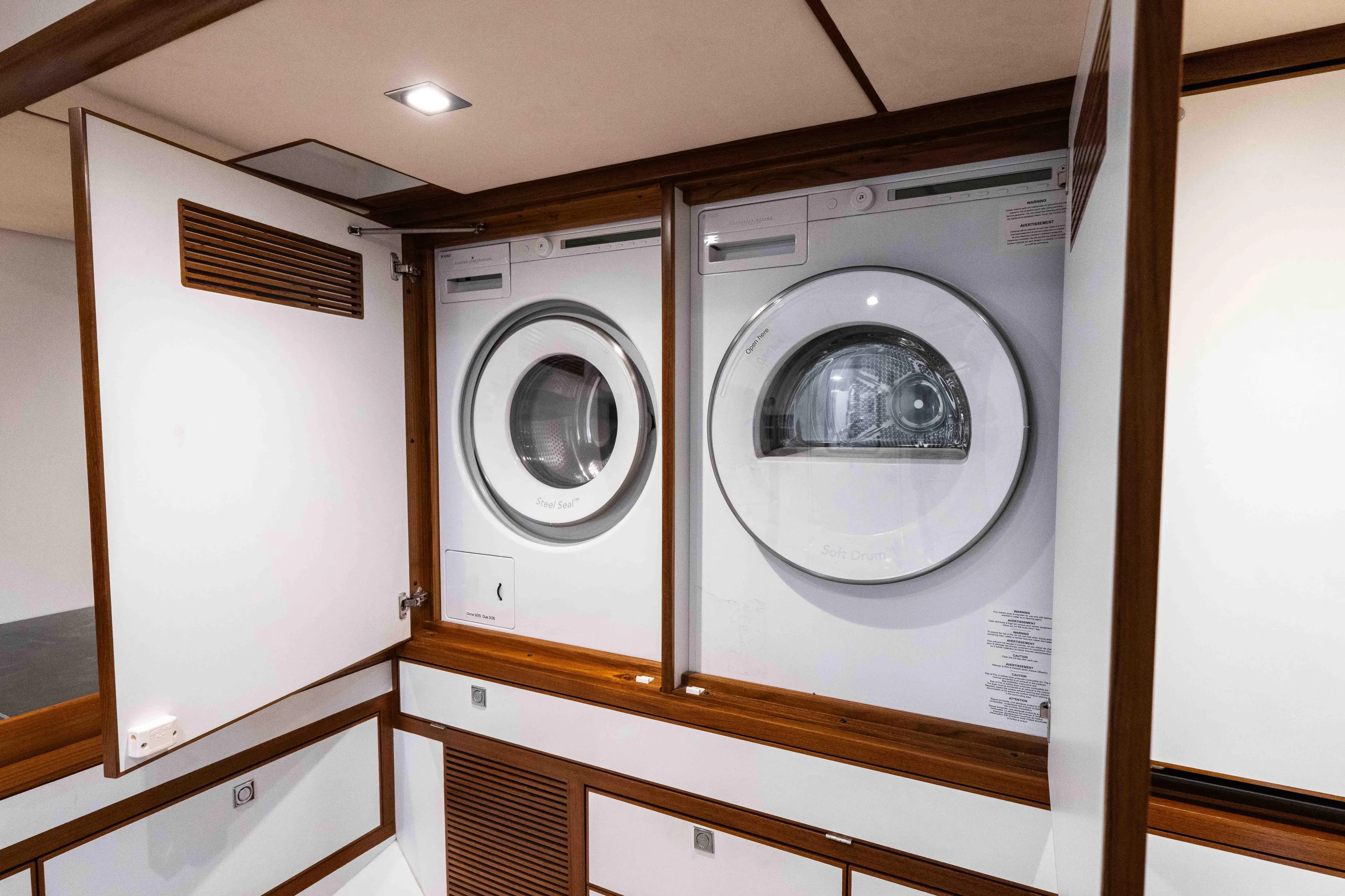 Martini Yacht Photos Pics Laundry area with washer and dryer on Nordhavn N63 yacht, 2022 model.