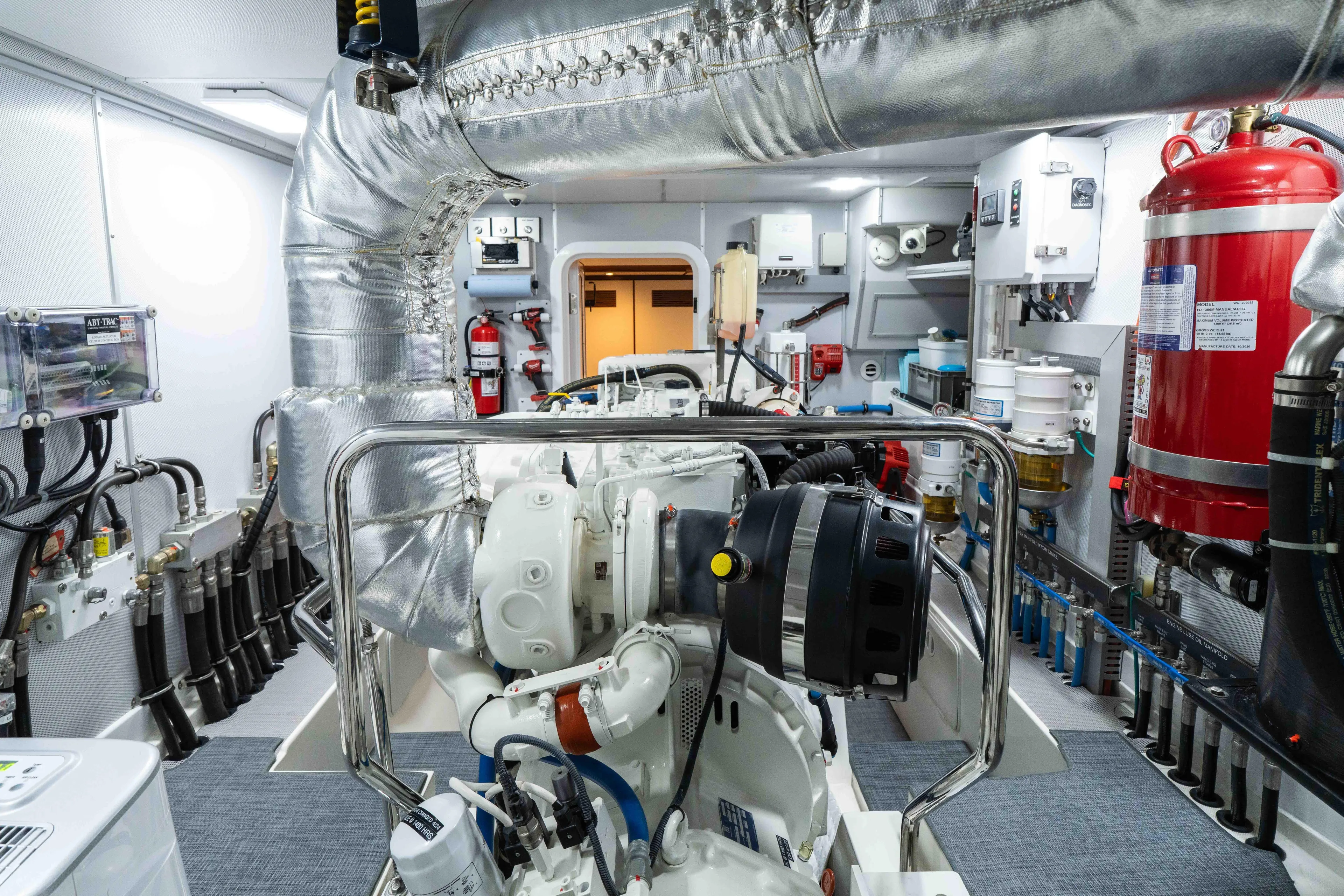 Martini Yacht Photos Pics Engine room of 2022 Nordhavn N63 yacht, featuring advanced machinery and safety equipment.