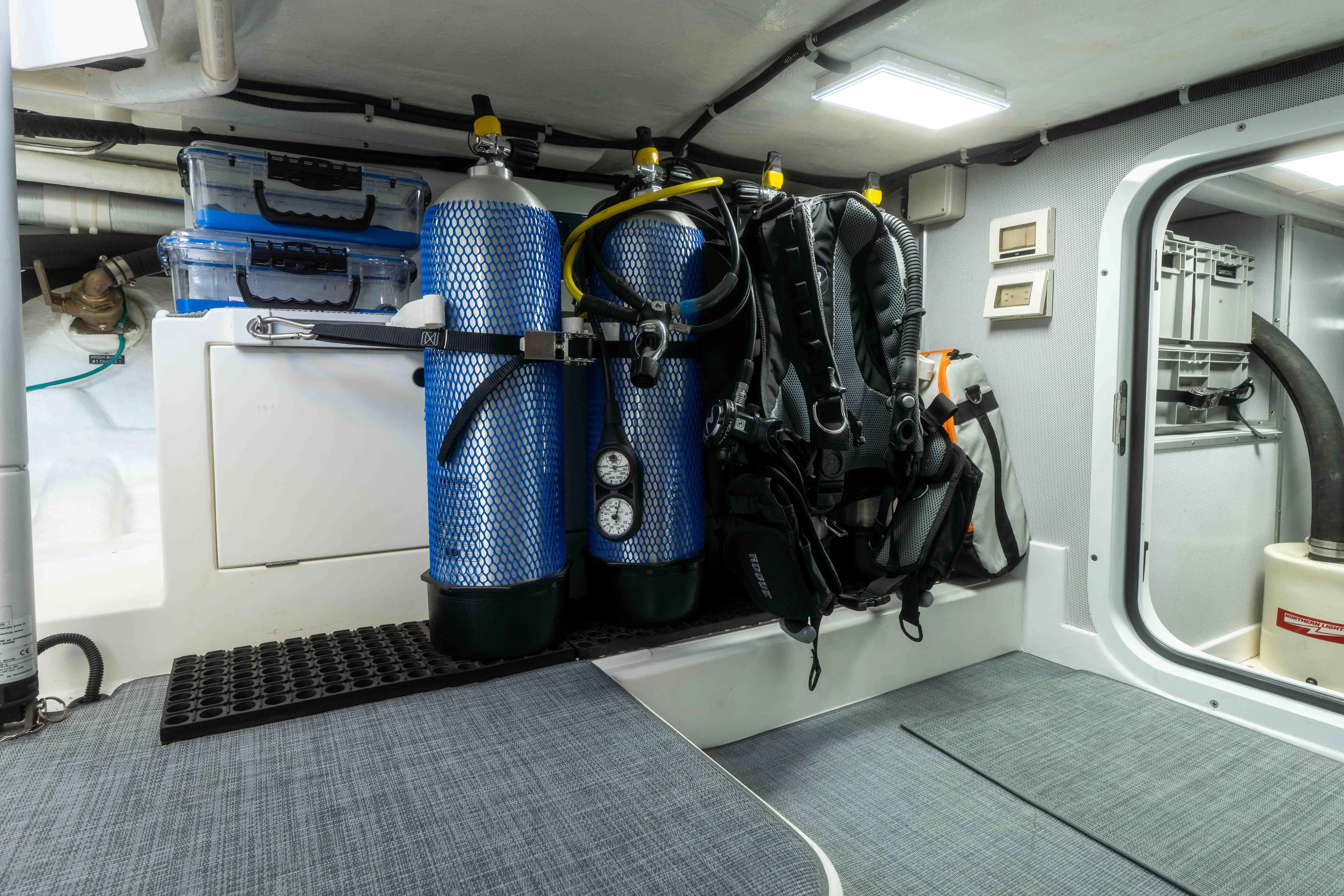 Martini Yacht Photos Pics Diving equipment storage on 2022 Nordhavn N63 yacht, featuring scuba tanks and gear.