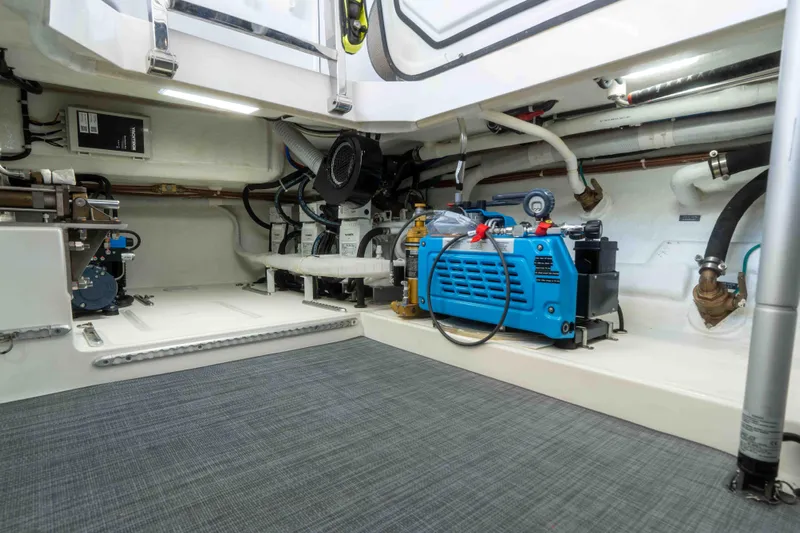 Martini Yacht Photos Pics Engine room of 2022 Nordhavn N63 yacht with equipment and piping.