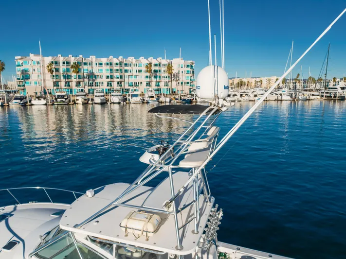 Pez Finder Yacht Photos Pics 2006 Rampage 38 Express yacht docked in marina with waterfront buildings.