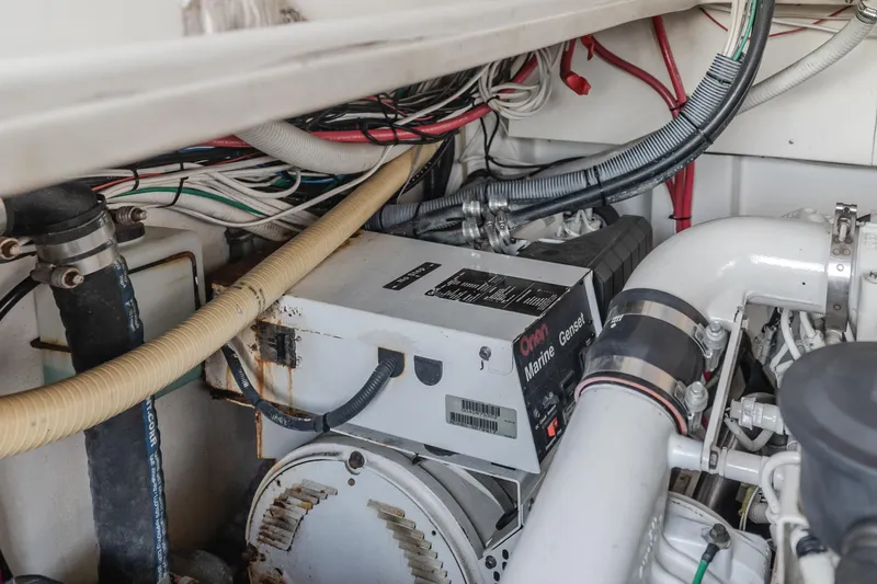 Pez Finder Yacht Photos Pics Engine room of 2006 Rampage 38 Express boat with generator and wiring.