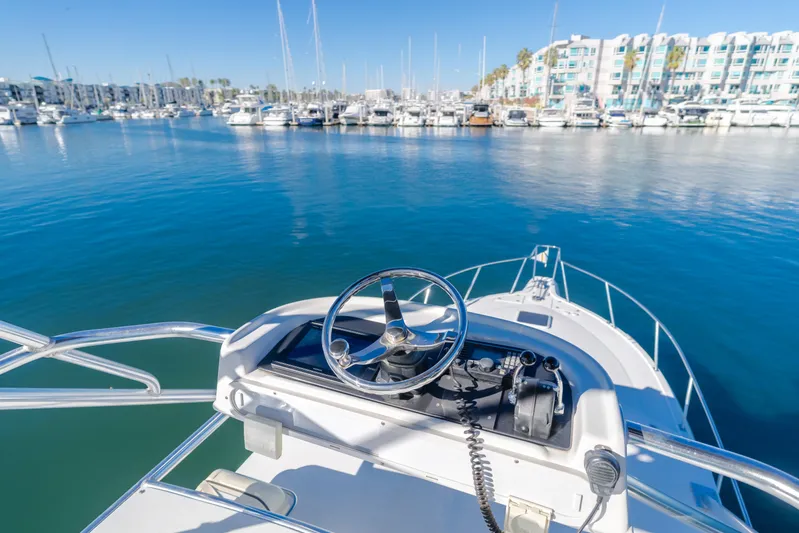 Pez Finder Yacht Photos Pics Rampage 38 Express 2006 boat helm overlooking marina with docked yachts.