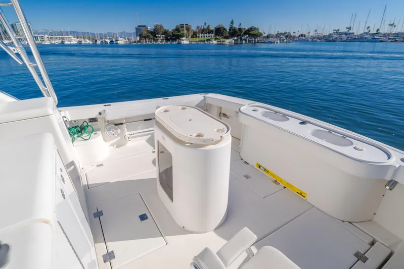 Pez Finder Yacht Photos Pics 2006 Rampage 38 Express boat deck with ocean view and marina in background.