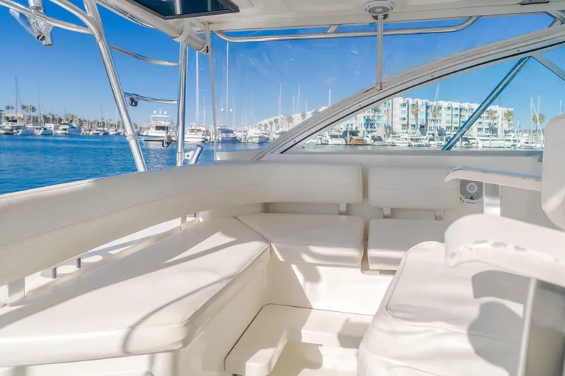 Pez Finder Yacht Photos Pics 2006 Rampage 38 Express yacht interior with white seating, marina view.