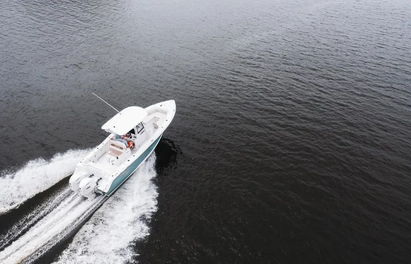 Yacht Photos Pics Aerial view of 2025 Sea Hunt Ultra 275 SE boat cruising on open water.