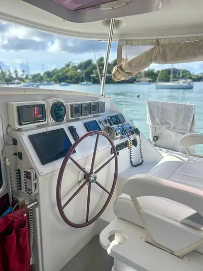 Whatabout Yacht Photos Pics 2005 Antares PDQ 44 yacht helm with scenic marina view.