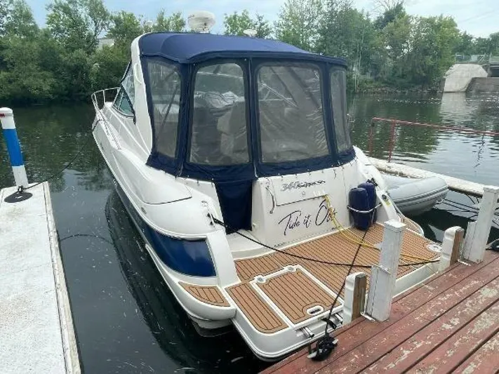  Yacht Photos Pics 2006 Cruisers Yachts 340 Express docked, featuring a sleek design and spacious deck area.