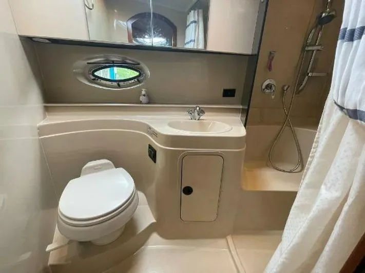  Yacht Photos Pics 2006 Cruisers Yachts 340 Express bathroom with toilet, sink, and shower.