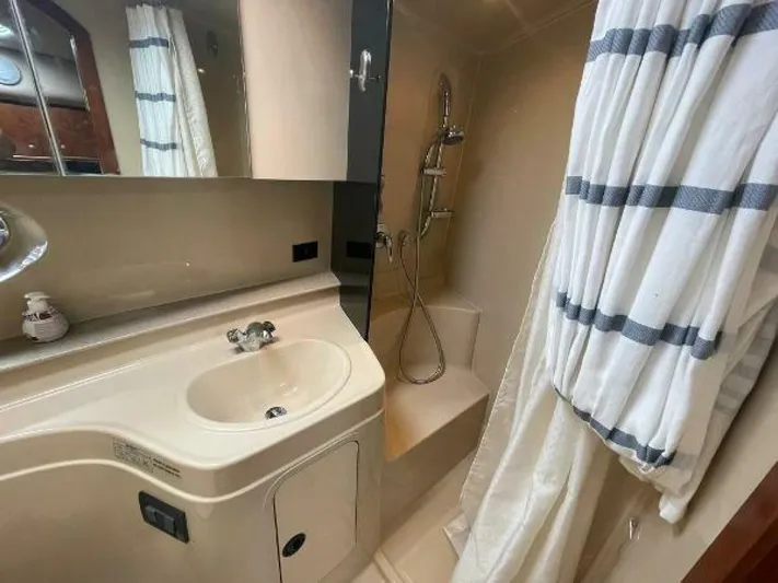  Yacht Photos Pics Bathroom interior of 2006 Cruisers Yachts 340 Express with sink and shower.