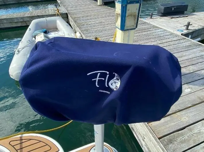  Yacht Photos Pics Blue cover on a docked 2006 Cruisers Yachts 340 Express boat.