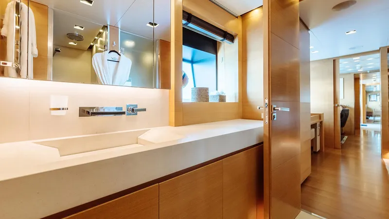 Away Yacht Photos Pics Luxurious bathroom interior on a 2009 Sanlorenzo SD125 yacht, featuring modern fixtures and wood accents.