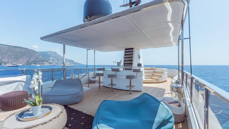 Away Yacht Photos Pics Luxurious Sanlorenzo SD125 yacht deck with modern seating, ocean view, and elegant design, 2009 model.