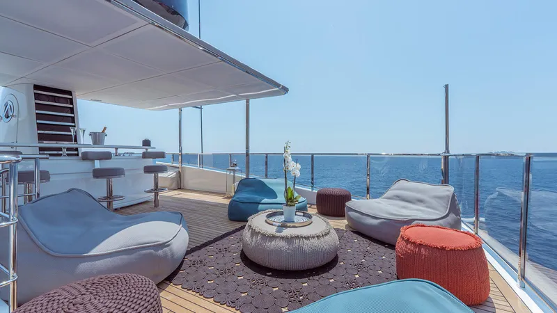 Away Yacht Photos Pics Luxurious Sanlorenzo SD125 yacht deck with modern seating, ocean view, and elegant decor, 2009 model.