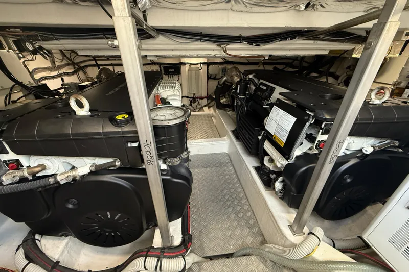 King Mouss Yacht Photos Pics Engine room of 2020 Pardo Yachts 43, showcasing dual engines and mechanical components.