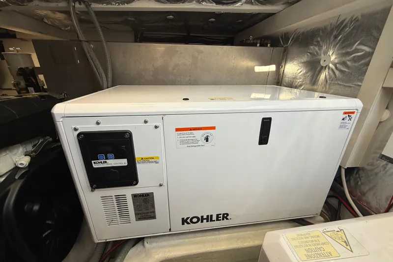 King Mouss Yacht Photos Pics Kohler generator in 2020 Pardo Yachts 43 engine room, showcasing marine power equipment.