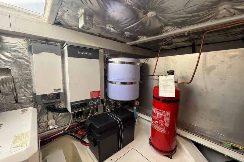 King Mouss Yacht Photos Pics Engine room of 2020 Pardo Yachts 43, featuring electrical systems and fire extinguisher.