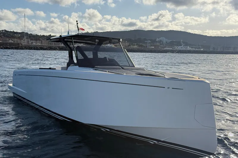 King Mouss Yacht Photos Pics 2020 Pardo Yachts 43 cruising on water with scenic coastal backdrop.