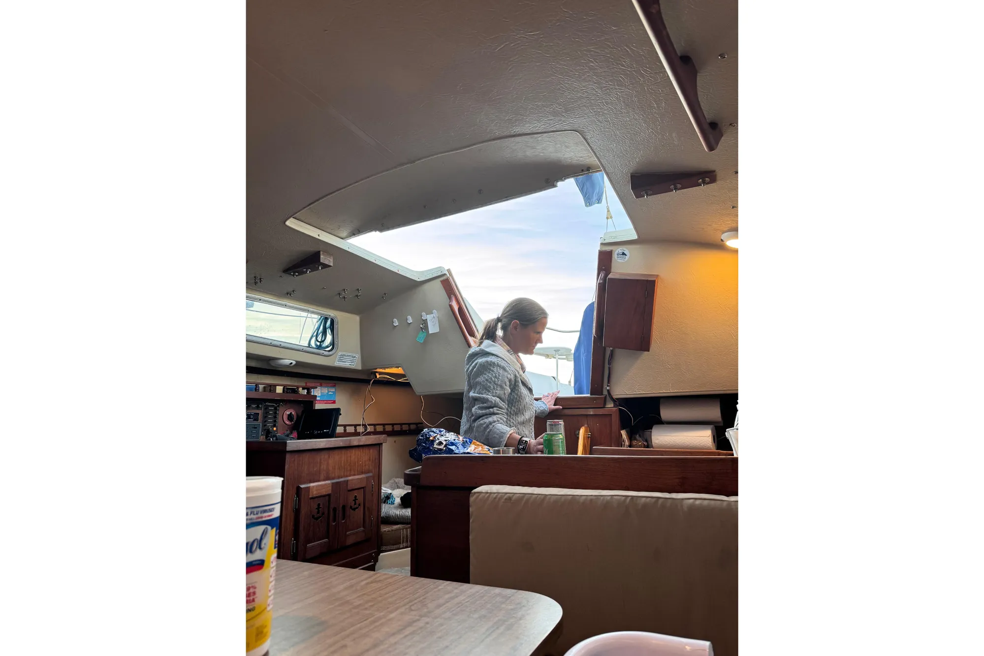 Interior of a 1980 Catalina 30 sailboat with a person in the cabin.