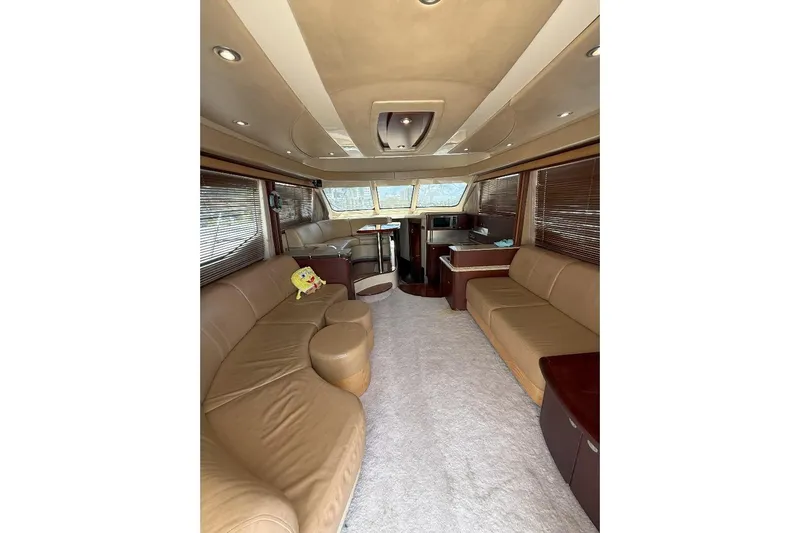 Yacht Photos Pics Luxurious interior of 2005 Sea Ray 500 Sedan Bridge yacht with plush seating and modern design.