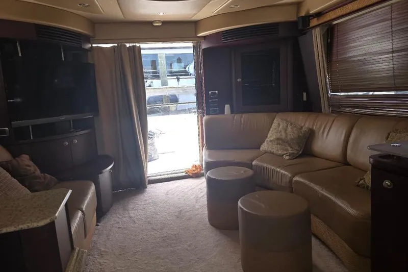  Yacht Photos Pics Luxurious interior of 2005 Sea Ray 500 Sedan Bridge yacht with plush seating and modern amenities.