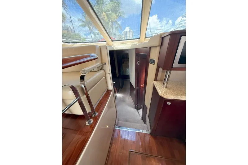  Yacht Photos Pics Interior view of 2005 Sea Ray 500 Sedan Bridge yacht with luxurious seating and wood finishes.